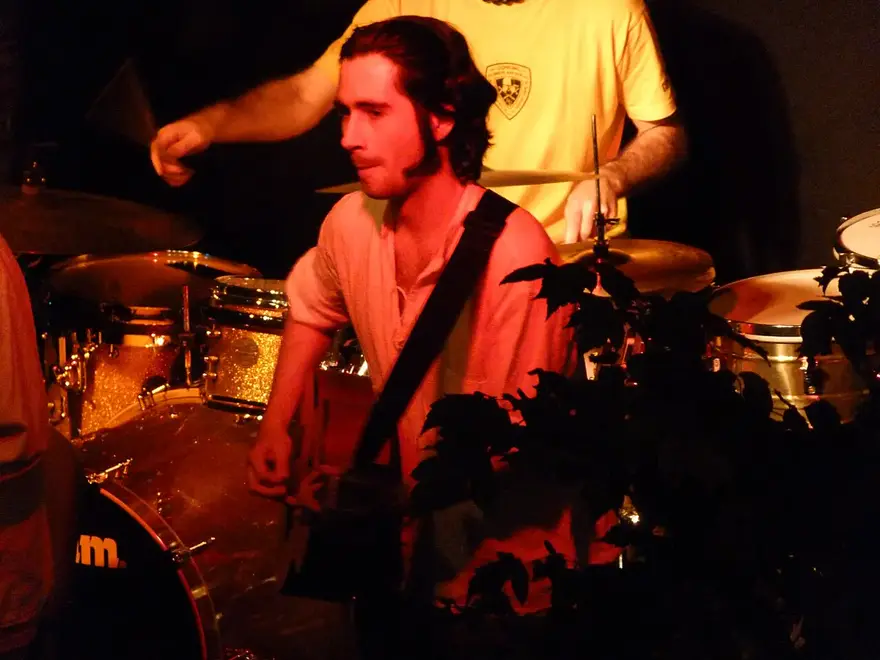 A percussionist playing live with a Cuban band